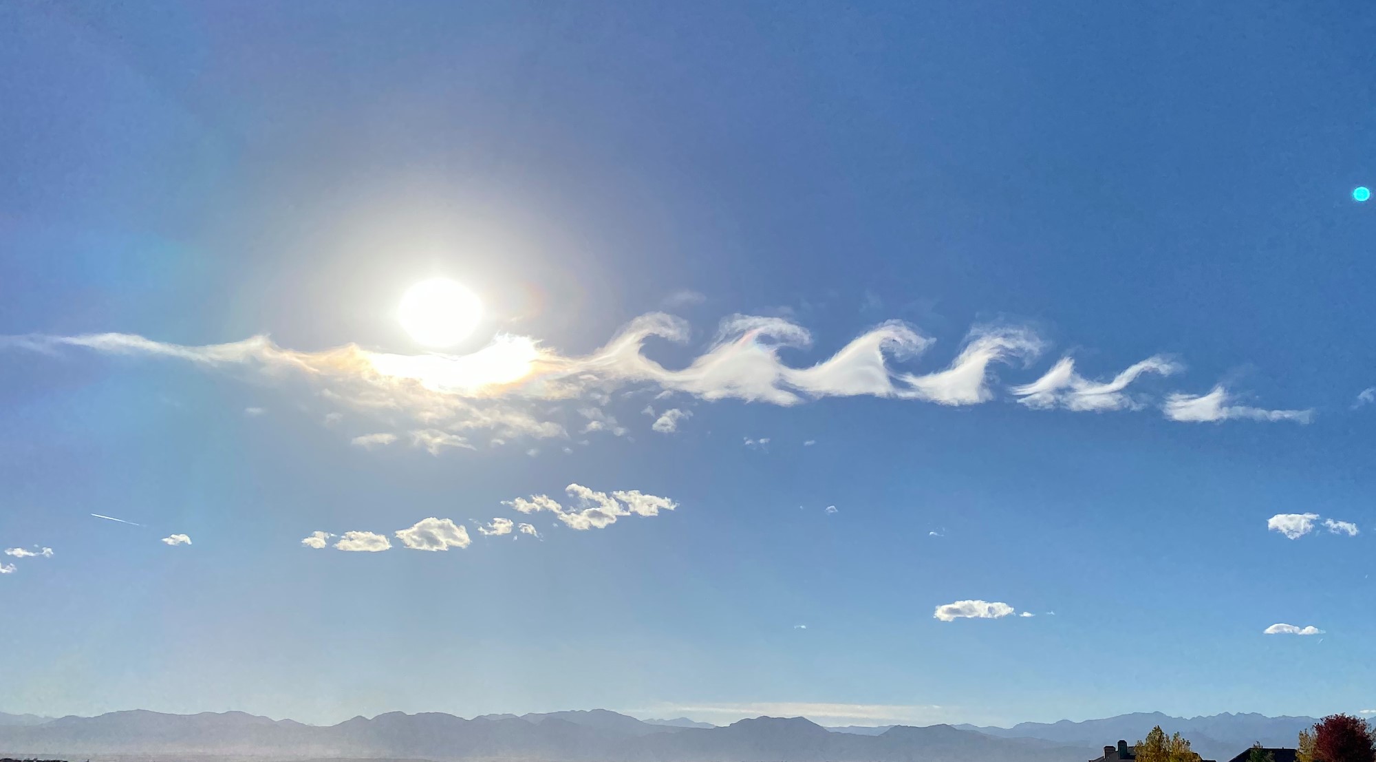 Kelvin-Helmholtz wave clouds are a type of gravity wave that occurs when there is a strong vertical shear between two air streams, causing winds to blow faster at the upper level than at the lower levels. 