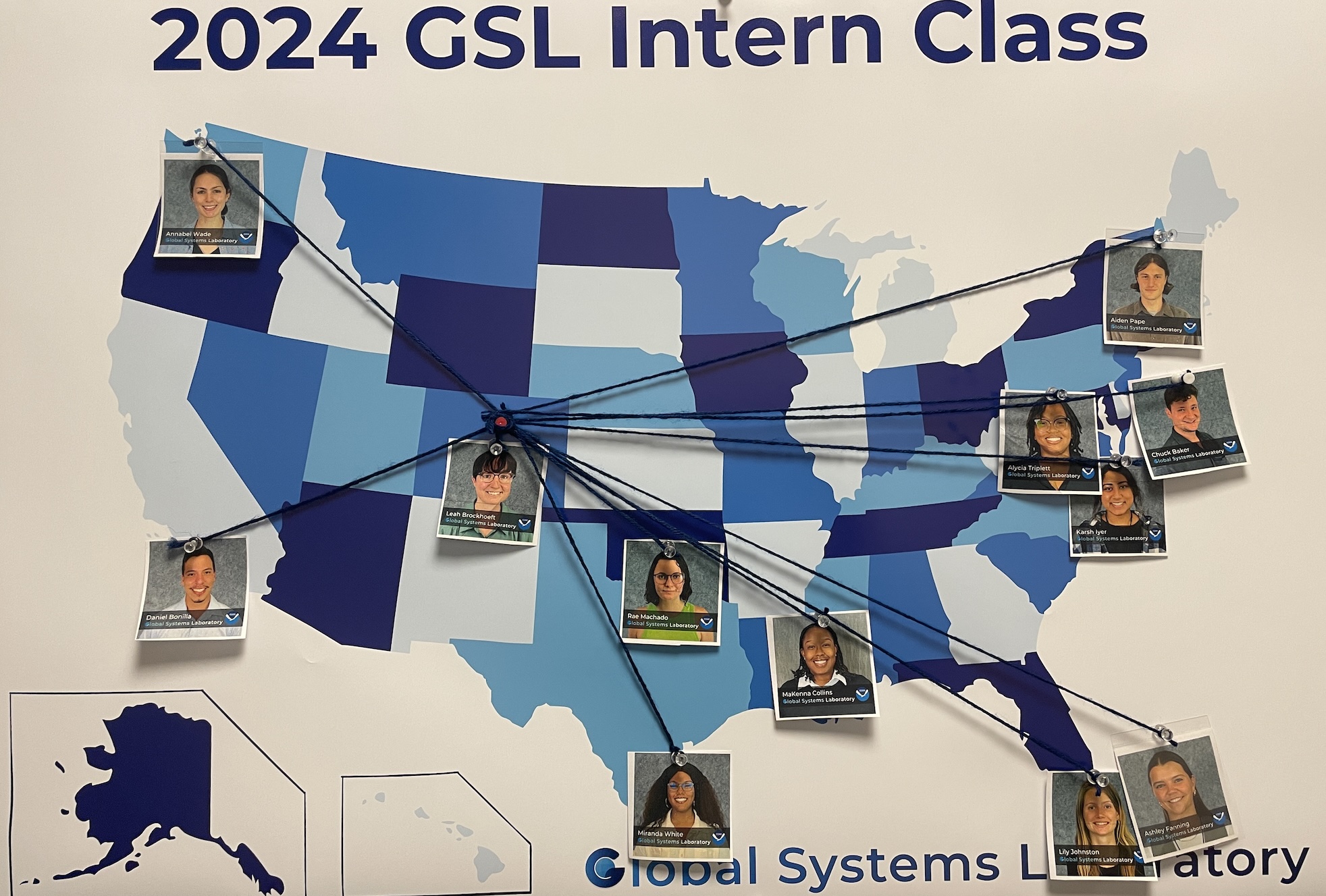 Map in shades of blue of the U.S. with photos of GSL interns pinned to the location of their university. Blue strings stretch from the student to a red pin identifying GSL in Boulder, CO.