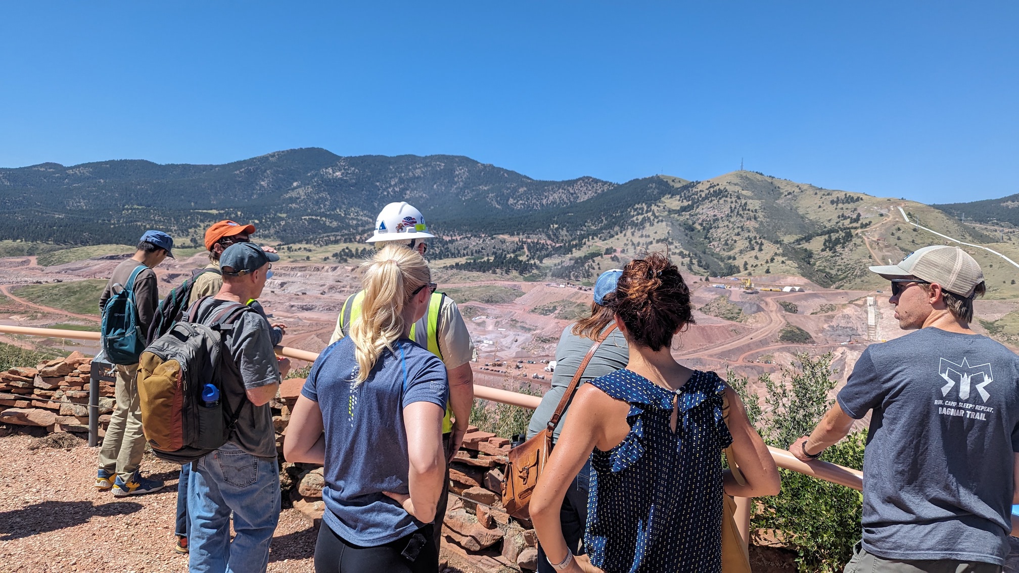 Caption: Scientists from NOAA's Physical Sciences Laboratory and the NOAA Global Systems Laboratory tour the Chimney Hollow Reservoir site in Colorado.