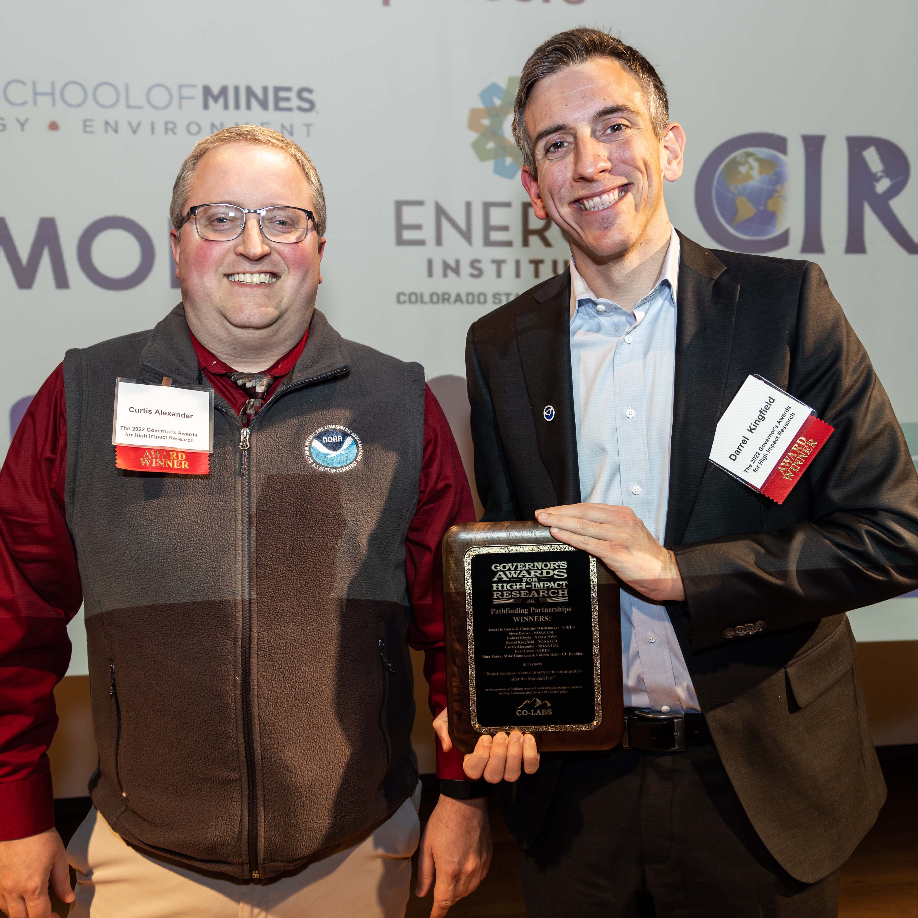 Curtis Alexander and Darrel Kingfield accept the CO-Labs Governor's Award for High Impact Research